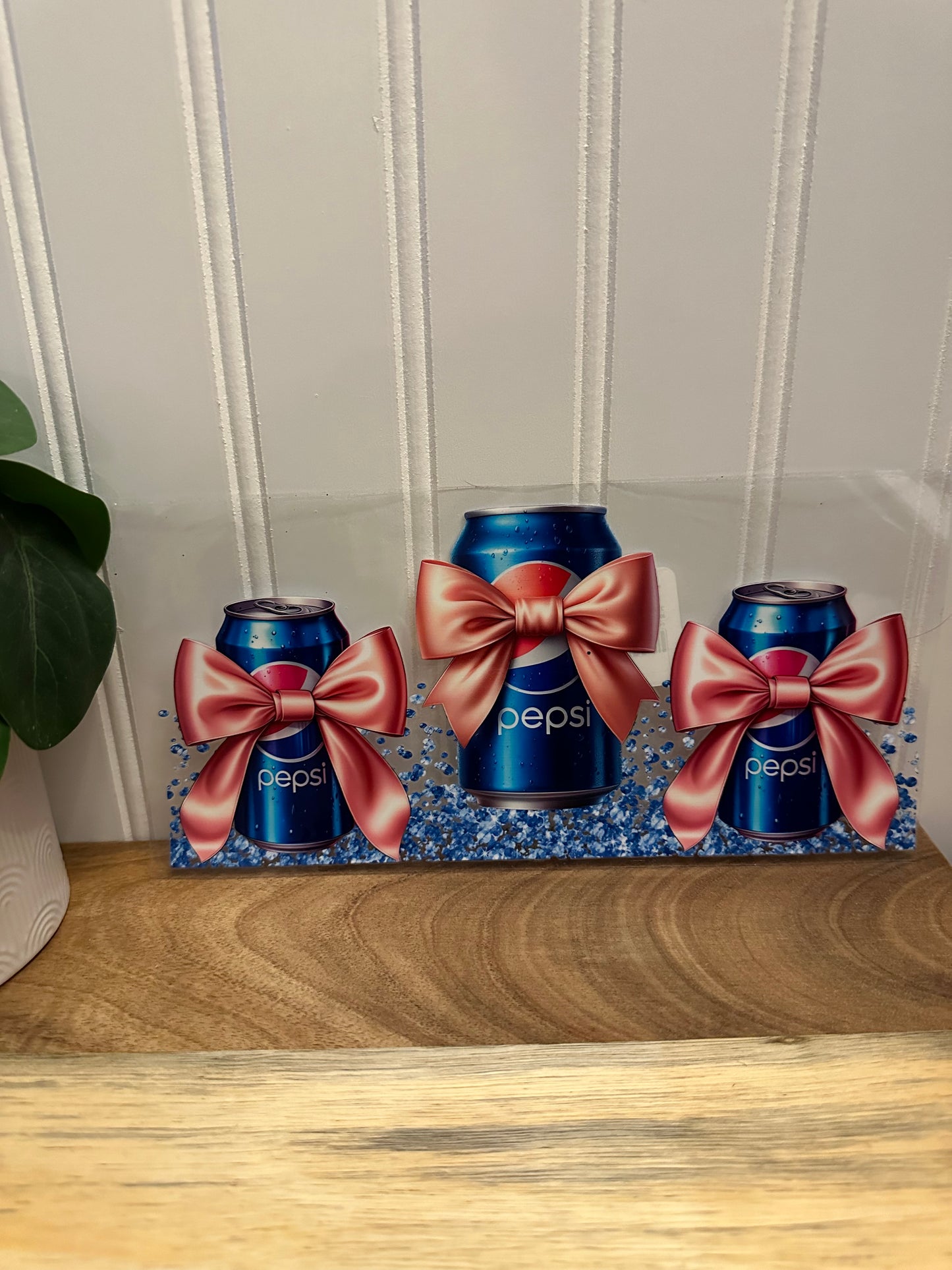 3 Pepsi cans with bows