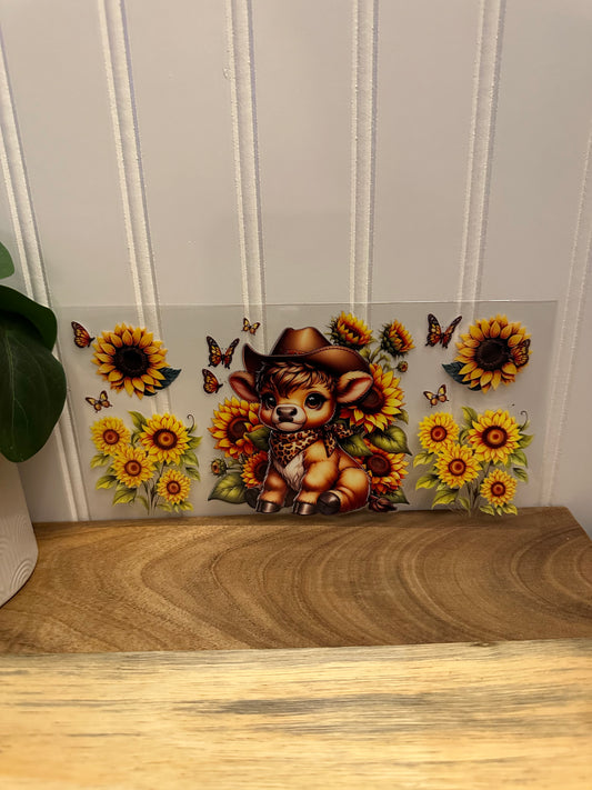 Cow with sunflowers and brown bandana