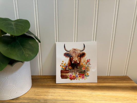 cow with barrel and flowers