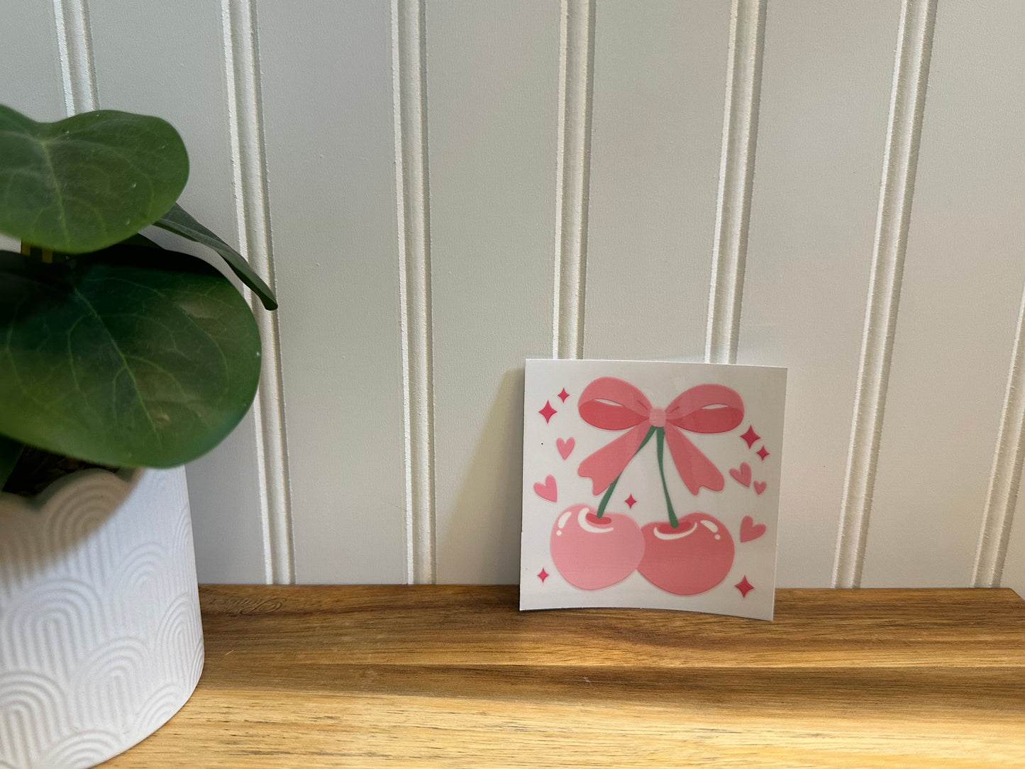 cherries with bow on stem