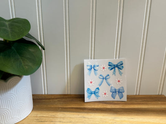 blue bow with white flowers